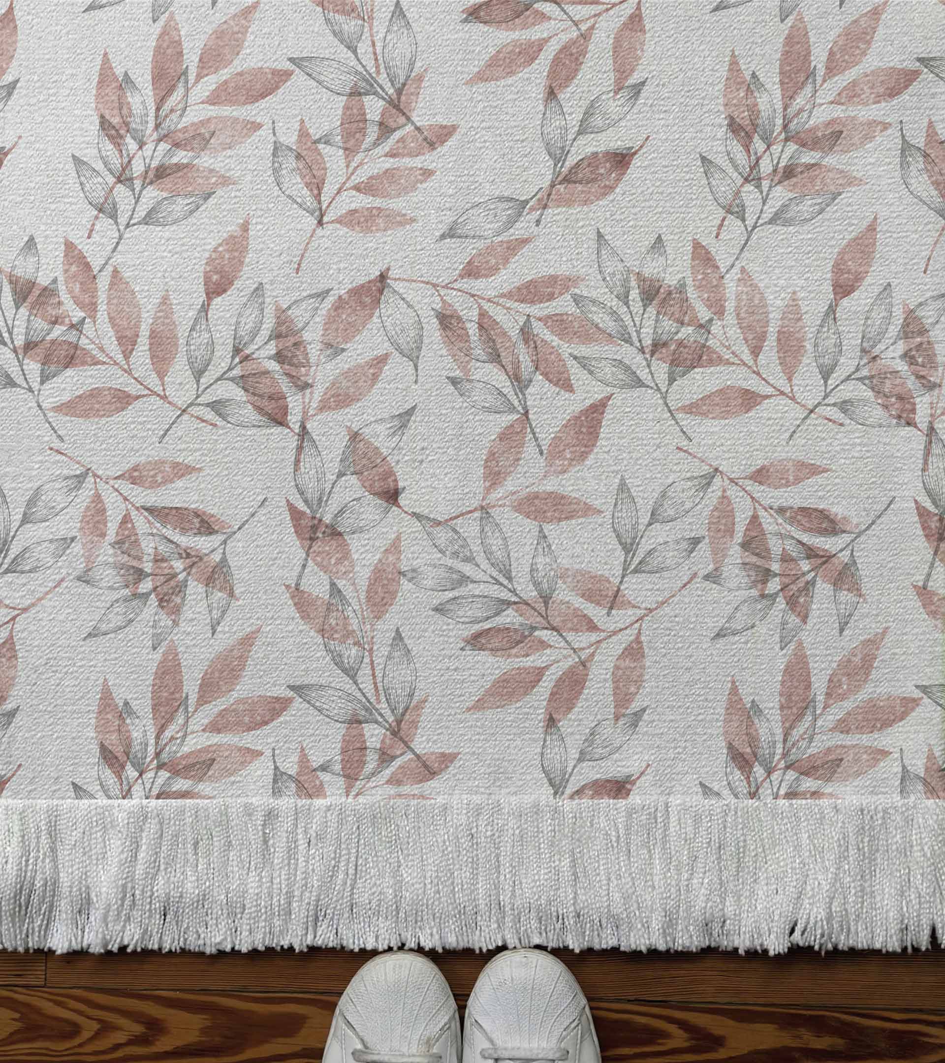 Alfombra tejida, diseño con hojas d ecolores, linea gris y color rosa. Naturaleza, botanico