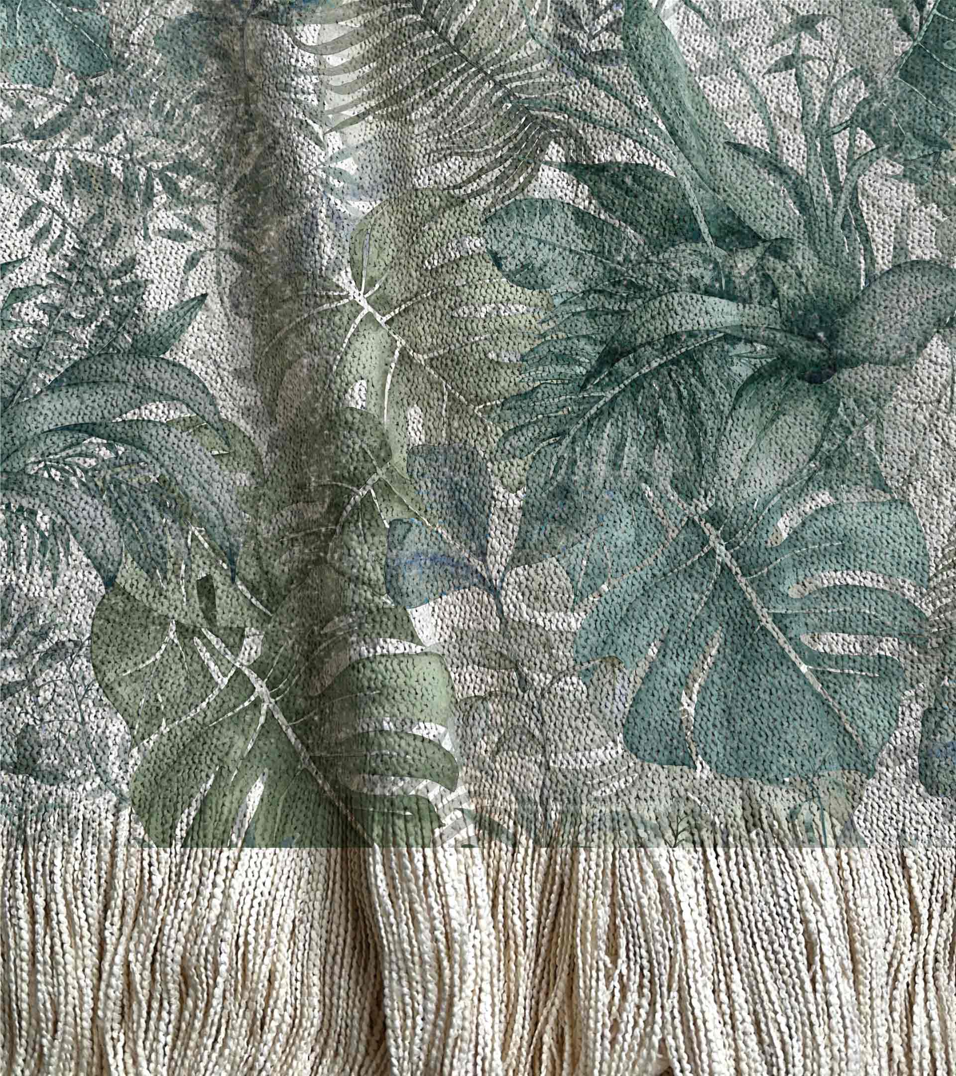 Manta tejida diseño botanico, con hojas grandes de color verde, selva, naturaleza